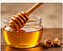 Miel de abejas pura y cuchara de madera